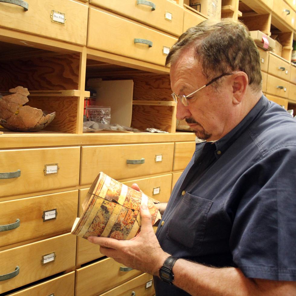 Professor James Brady looking at find