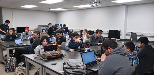 Computer Science Students Working Together in Classroom