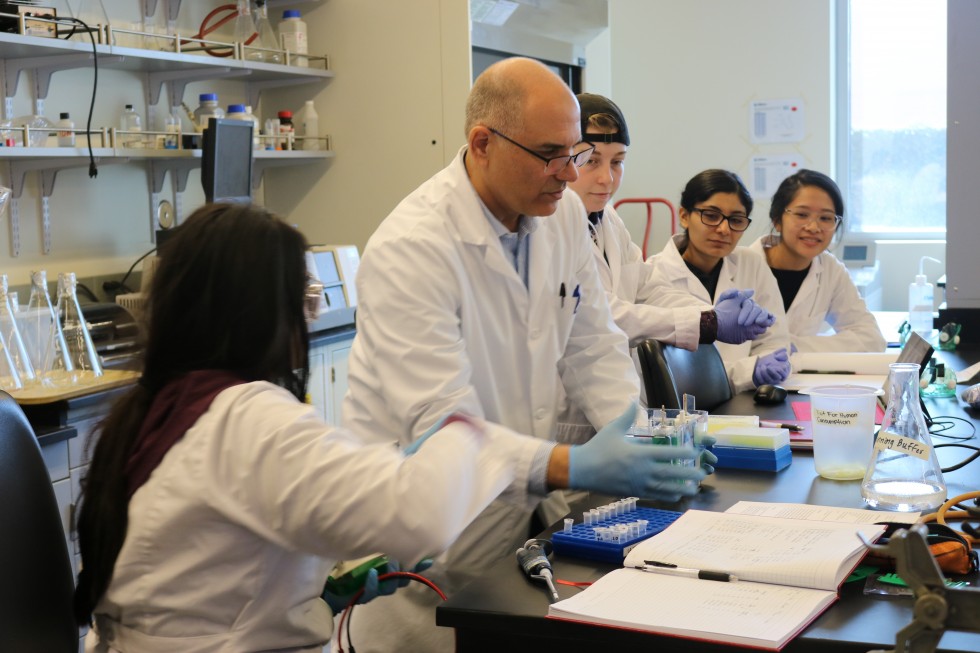 Professor and students in lab 