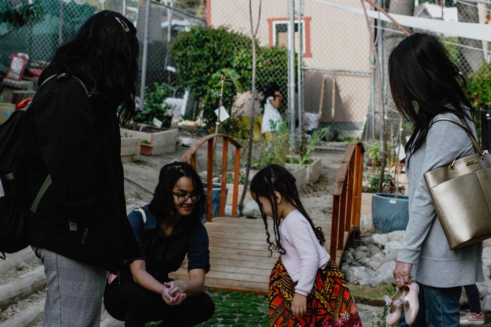   Students and child in the garden.