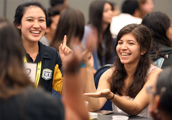 Students sitting around  table