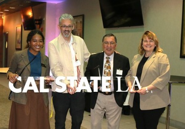 Guests posing for photo at Educators' Mixer