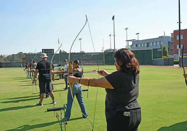 Students practicing archery.