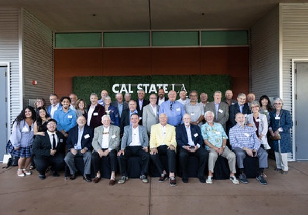 Group of Sigma Nu Alumni posing for group photo. 