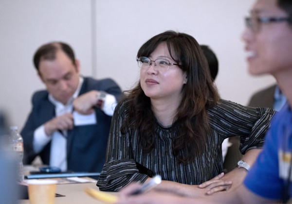 cs faculty smiling during meeting presentation