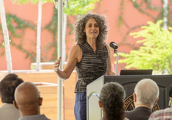 Daphne Miller speaks at lectern