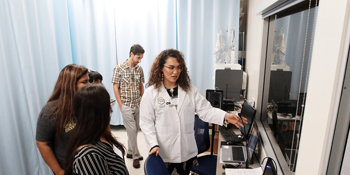 Nursing students looking at new lab