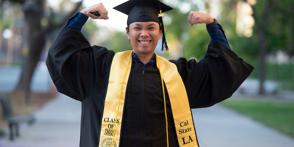 male graduate wearing black cap and gown