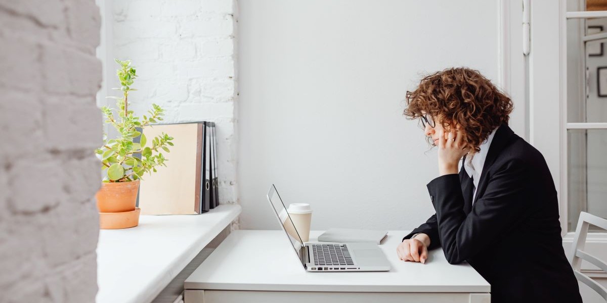 Woman sitting down at laptop