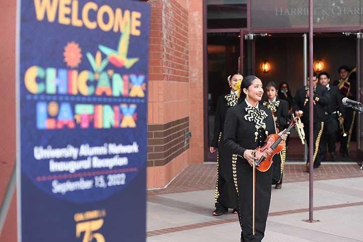 Musicians enter stage to perform on instruments