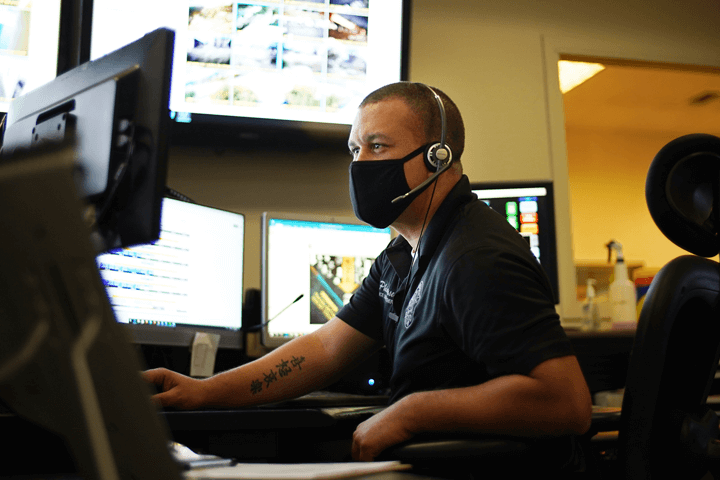 Dispatch surrounded by computer screens