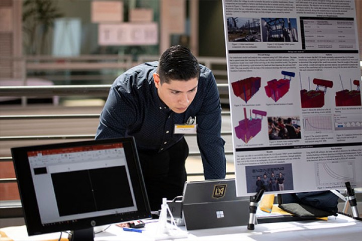 person next to computer and electronics