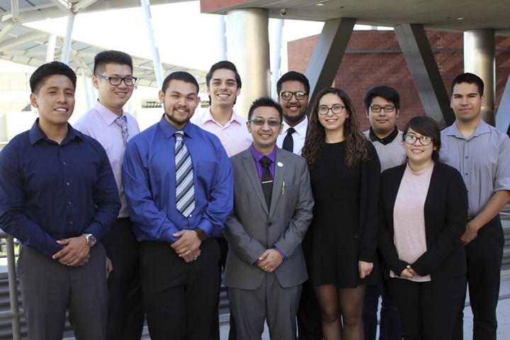 ECST Scholarship winners smile posing outdoors.