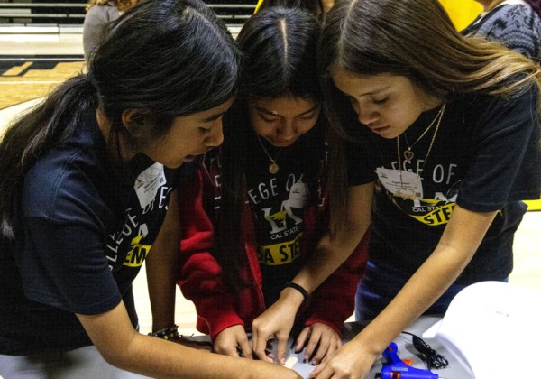 Students working together on a jumping robot project.