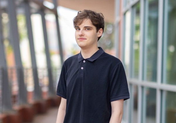 Student Jordan O'Kelley wearing a black polo shirt