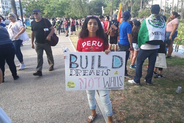 student holding a banner