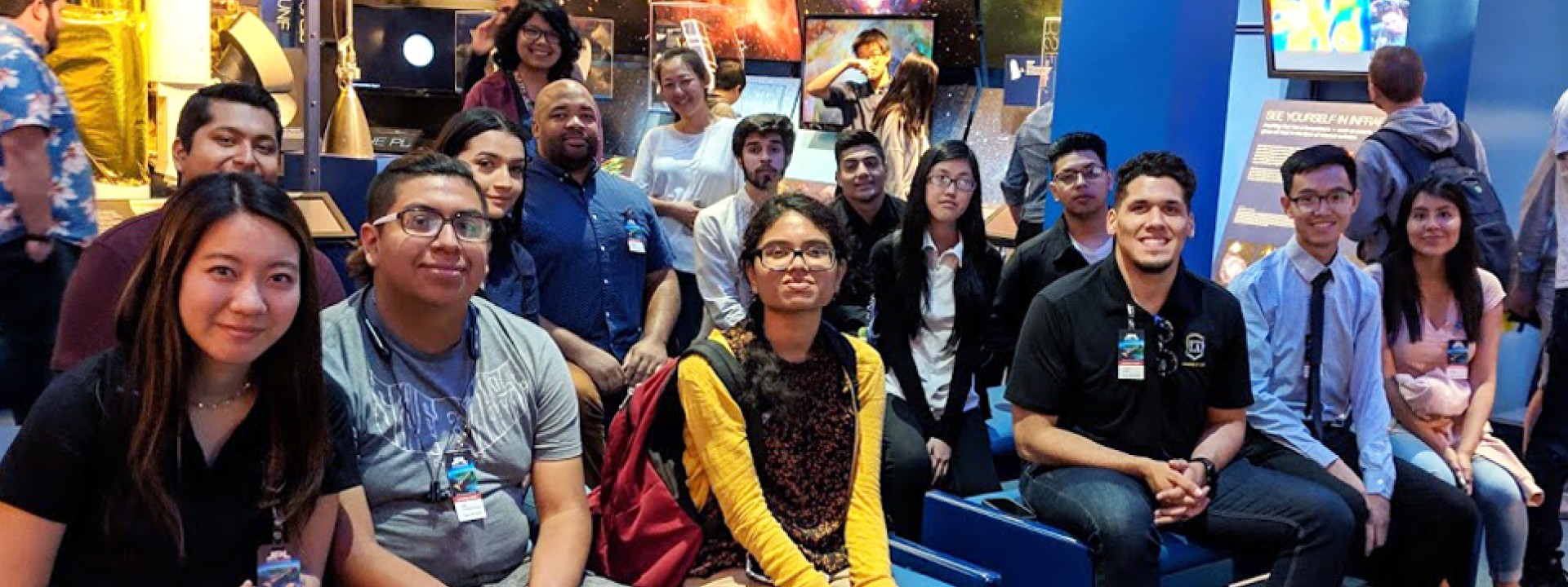 jpl trip students seated at exhibit