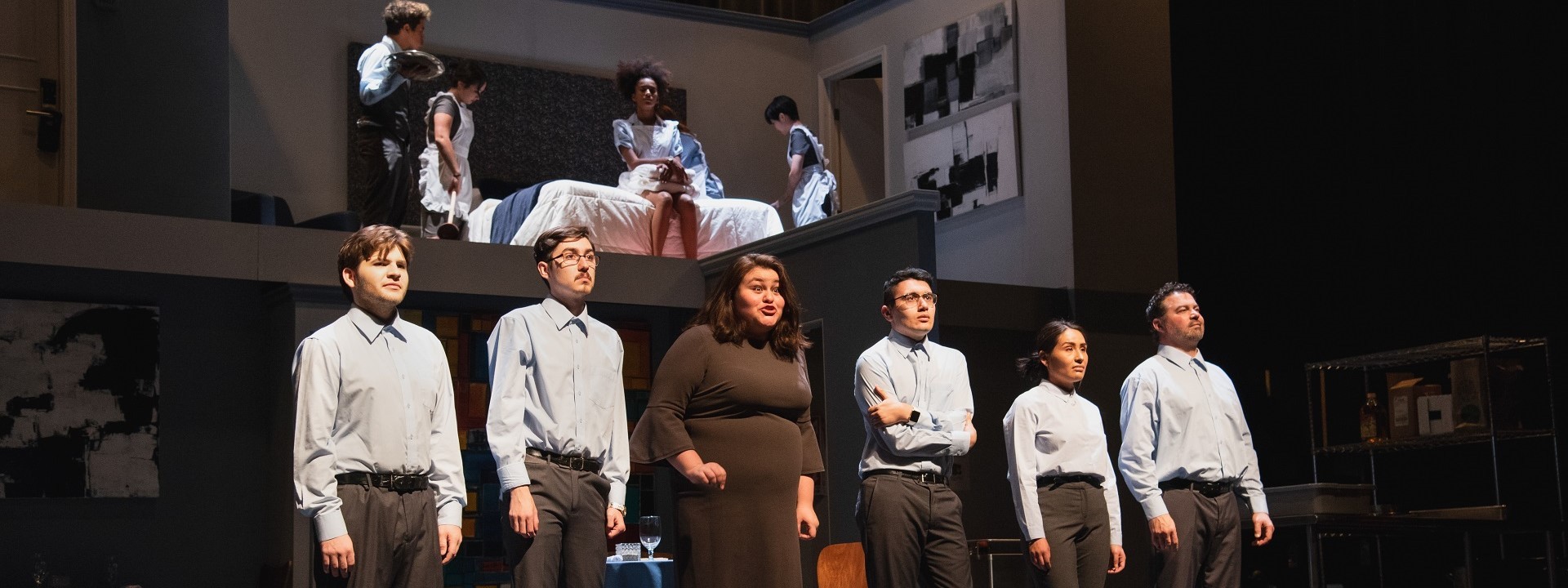 Six cast members downstage and four cast members upstage/above in a scene from "We the Invisibles"